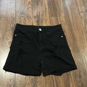 black jean shorts.